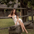 girl-sitting-on-wooden-fence-bench-sl-3840x2160.jpg