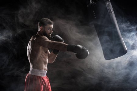 depositphotos 138051138-stock-photo-young-boxer-punching