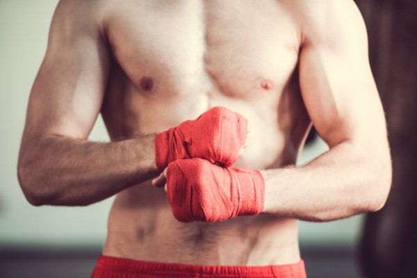 handsome-bearded-boxer-with-bare-torso-wrapping-his-hands 855